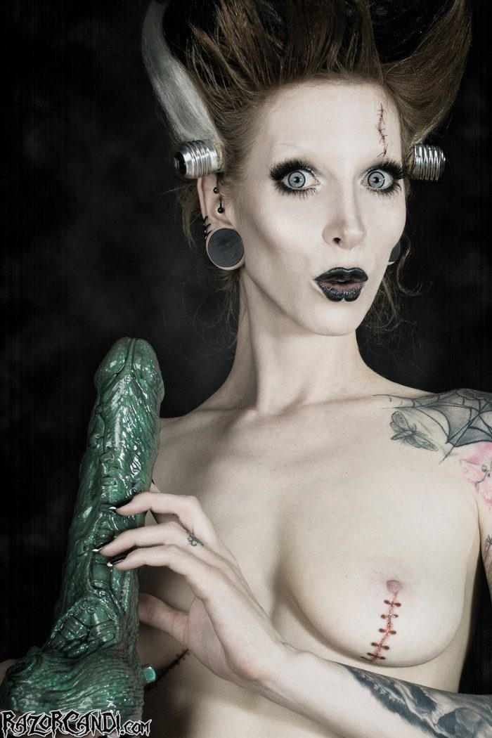 Tattoo model Razor Candi sucks on a big dildo in Bride of Frankenstein attire-06
